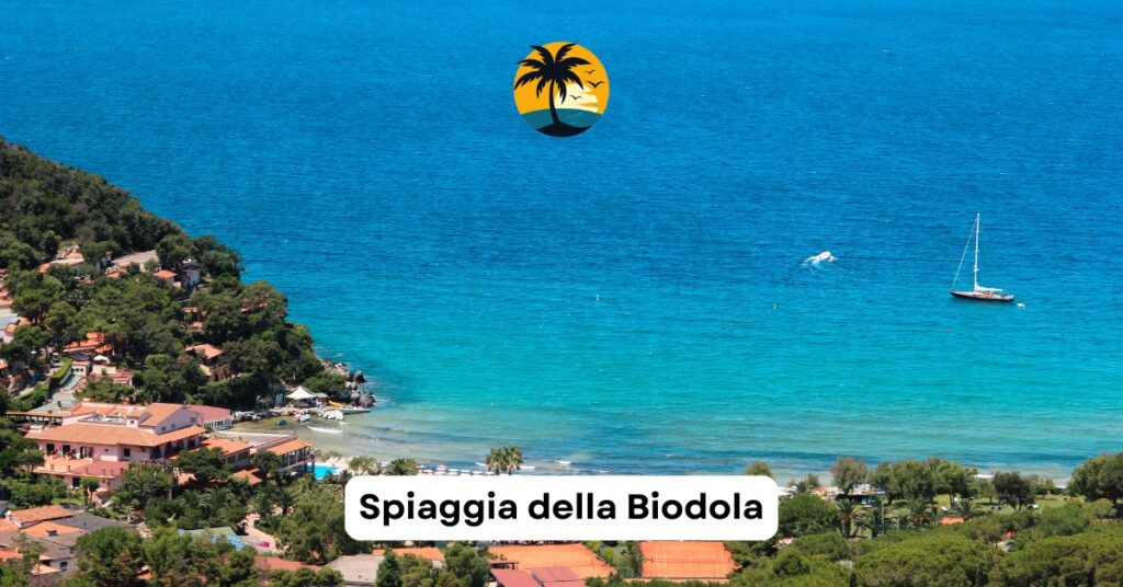 Family-friendly Spiaggia della Biodola with calm waters and lush surroundings on Elba Island, Tuscany.