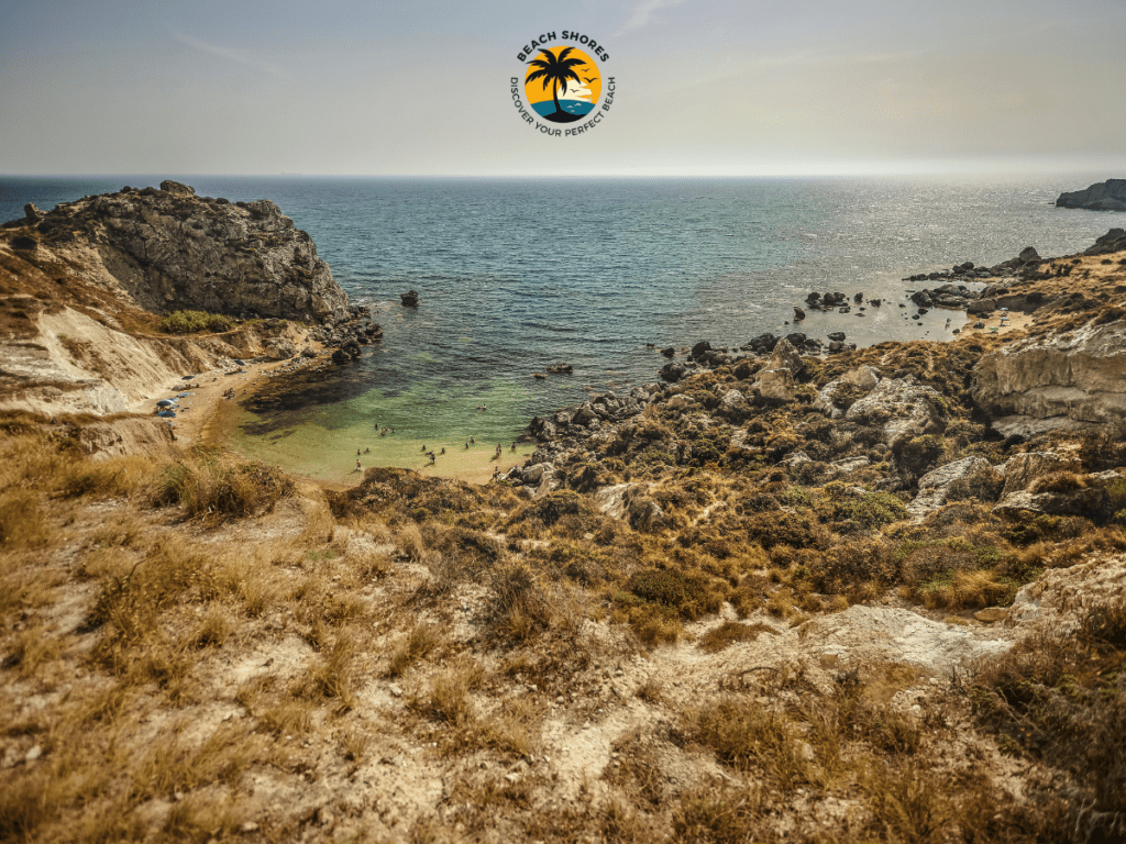 Cala Paradiso, one of the top Monopoli Italy Beaches featuring clear waters and vibrant beach bars.