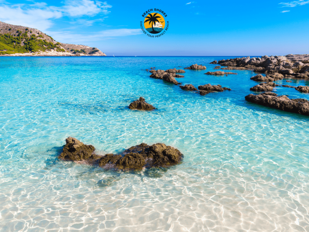 Cala Susca, serene Monopoli Italy Beach with pebble shores and crystal-clear Adriatic waters.