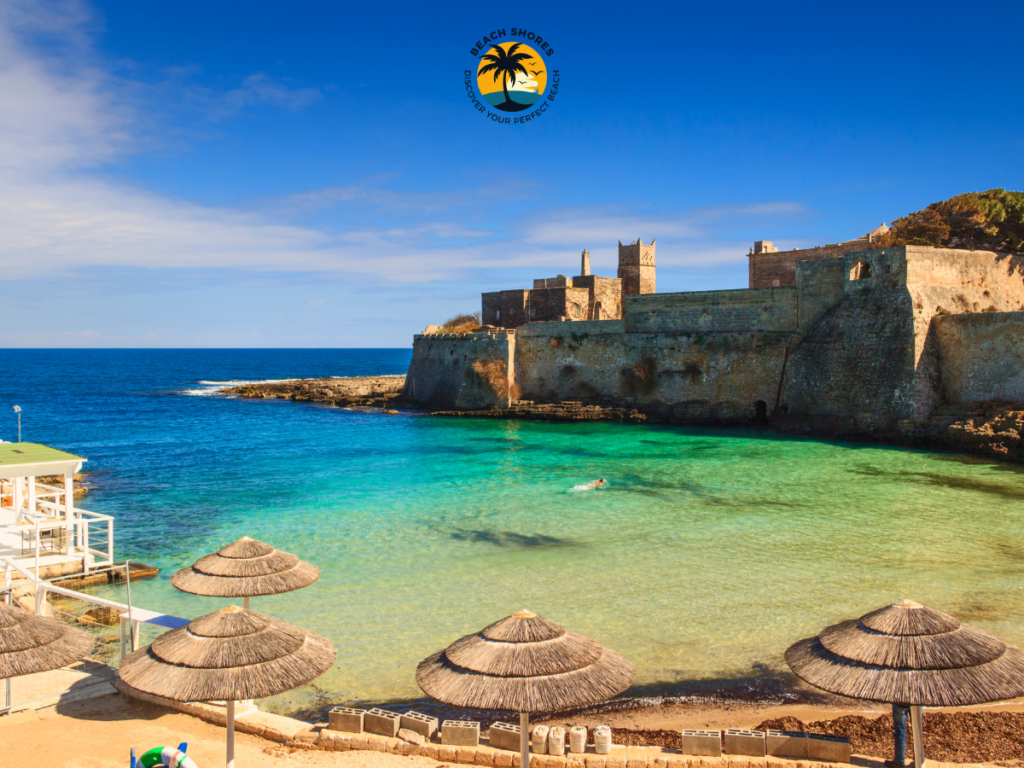 Porto Ghiacciolo, scenic Monopoli Italy Beach with pebbly sand and views of the historic abbey.