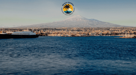 Breathtaking view of Catania beaches with crystal-clear waters and Mount Etna in the background.